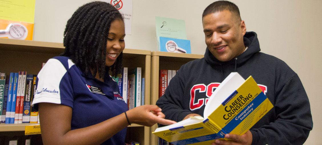 Students examining a book