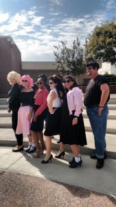 Faculty in Grease costumes